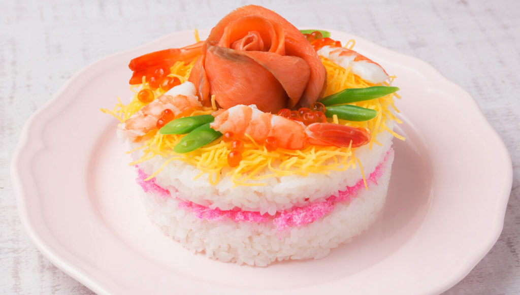 Delicious sushi cake with salmon and shrimp