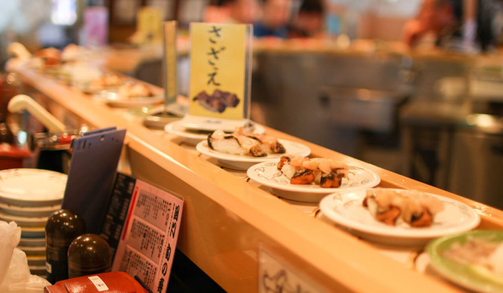 Serving sushi from sushi making robot: Conveyor Belt Sushi Place