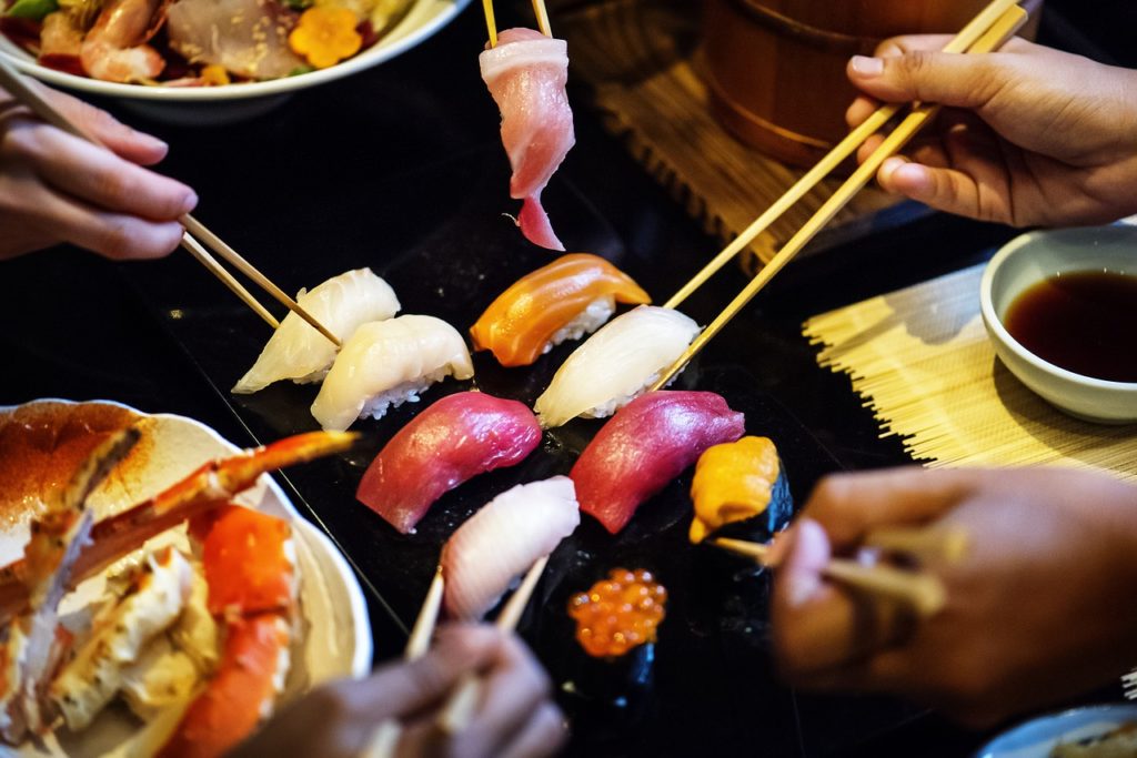 Group eating Japanese Sushi