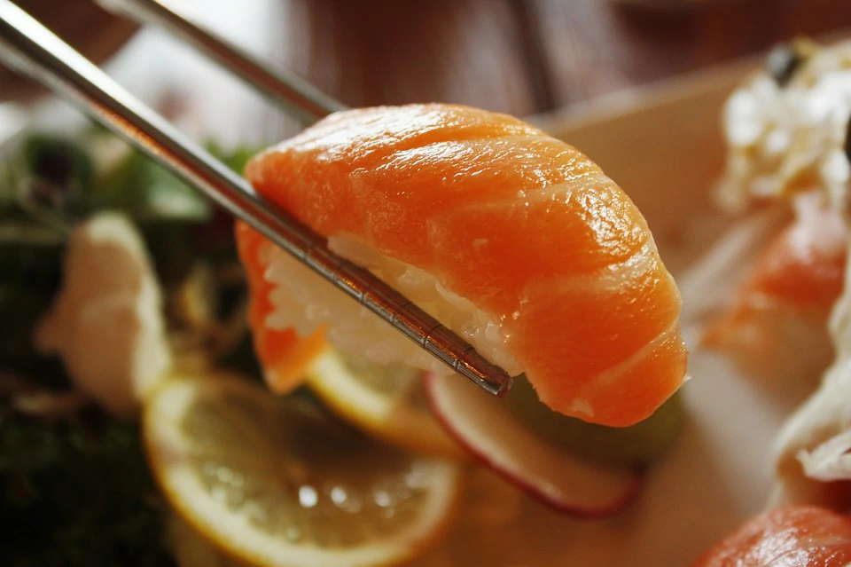 Salmon sushi being prepared